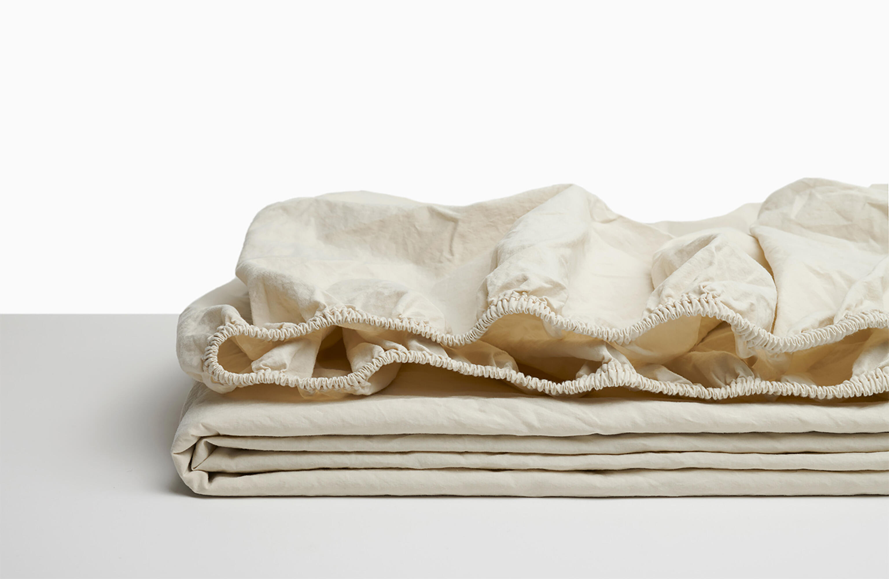 Sábana bajera wash garment percal 200 hilos beige avena para cama de 150 cm