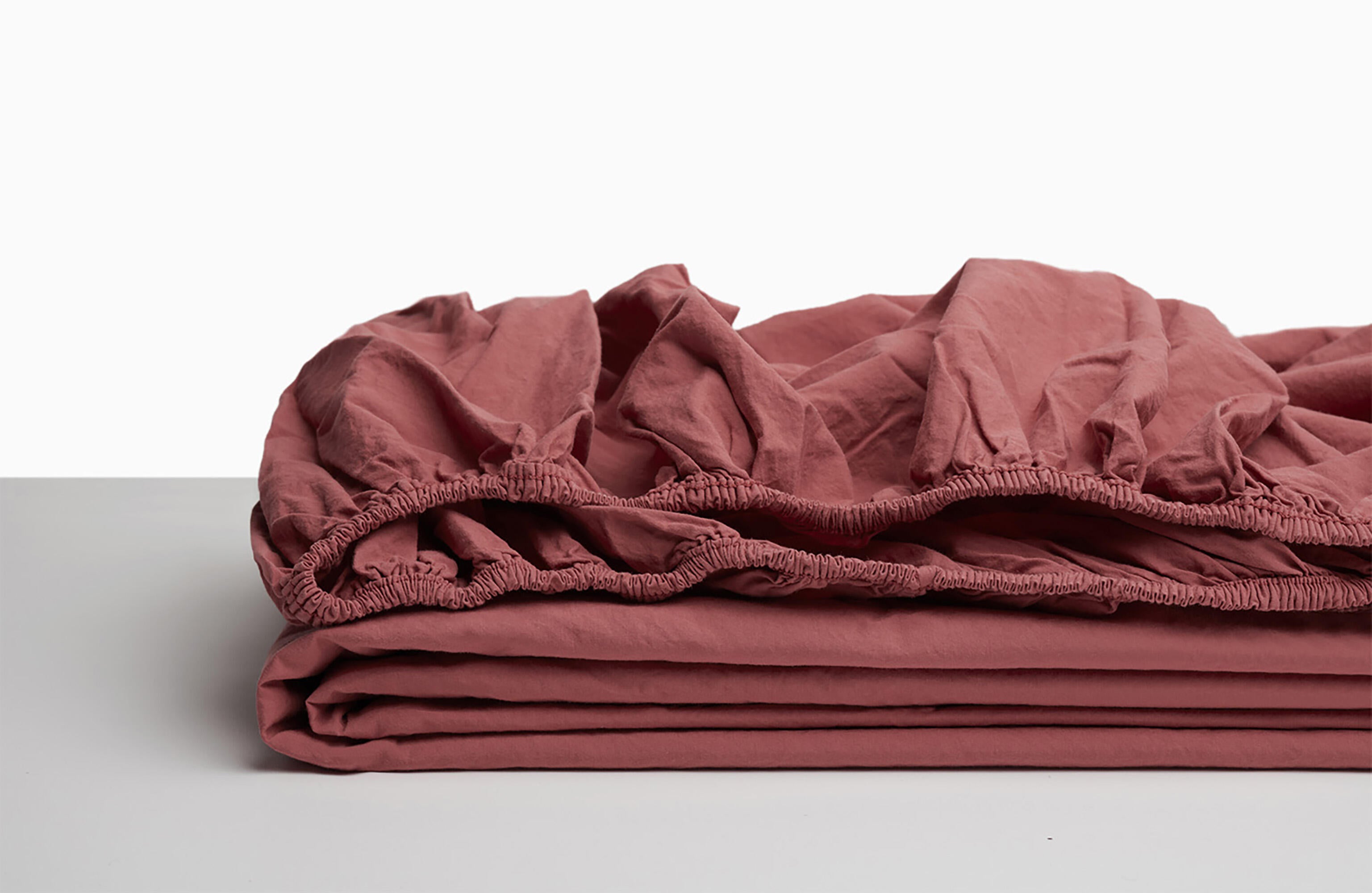 Sábana bajera wash garment percal 200 hilos rojo ahumado para cama de 200 cm