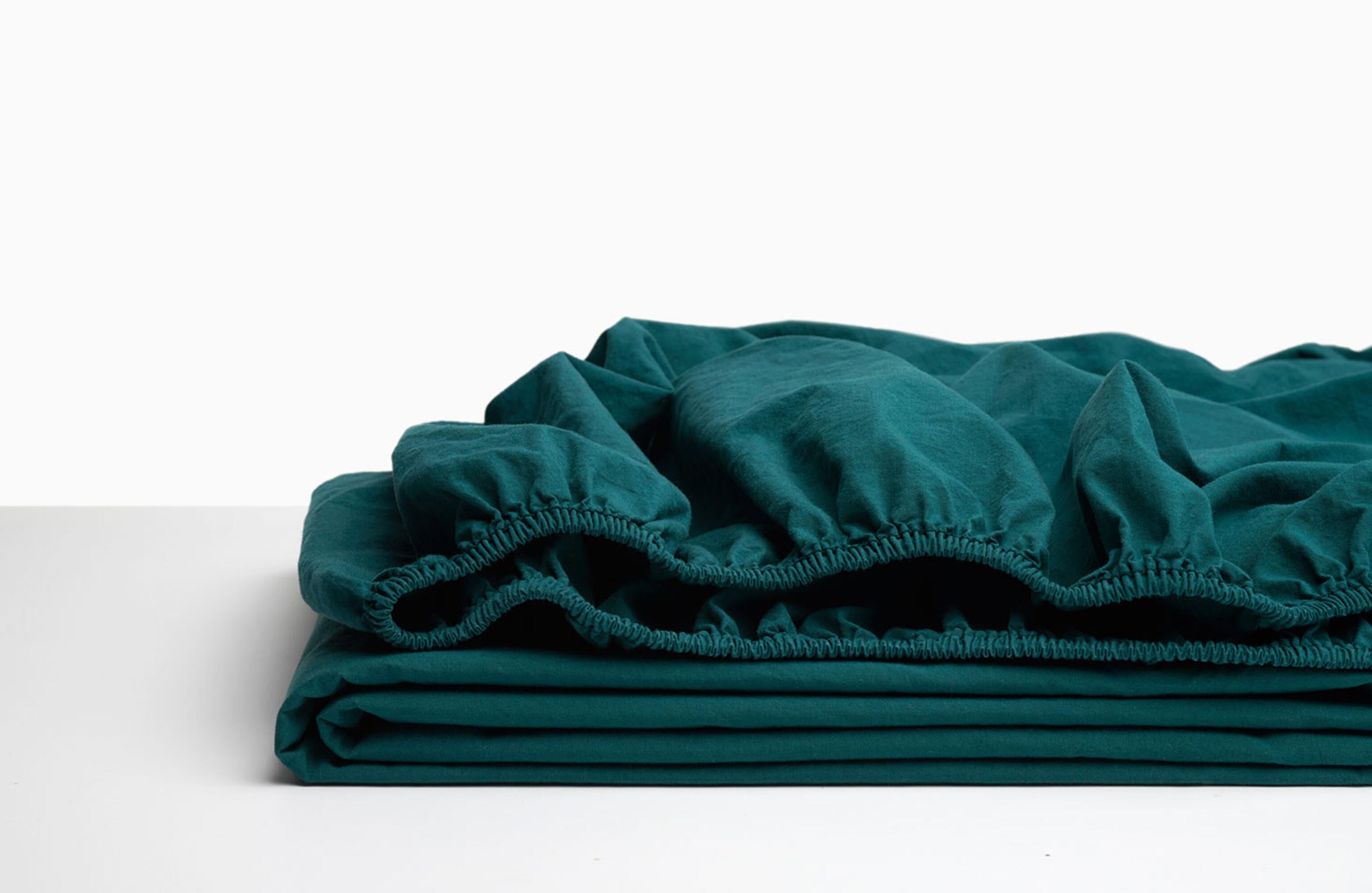 Sábana bajera wash garment percal 200 hilos verde azulado para cama de 135 cm