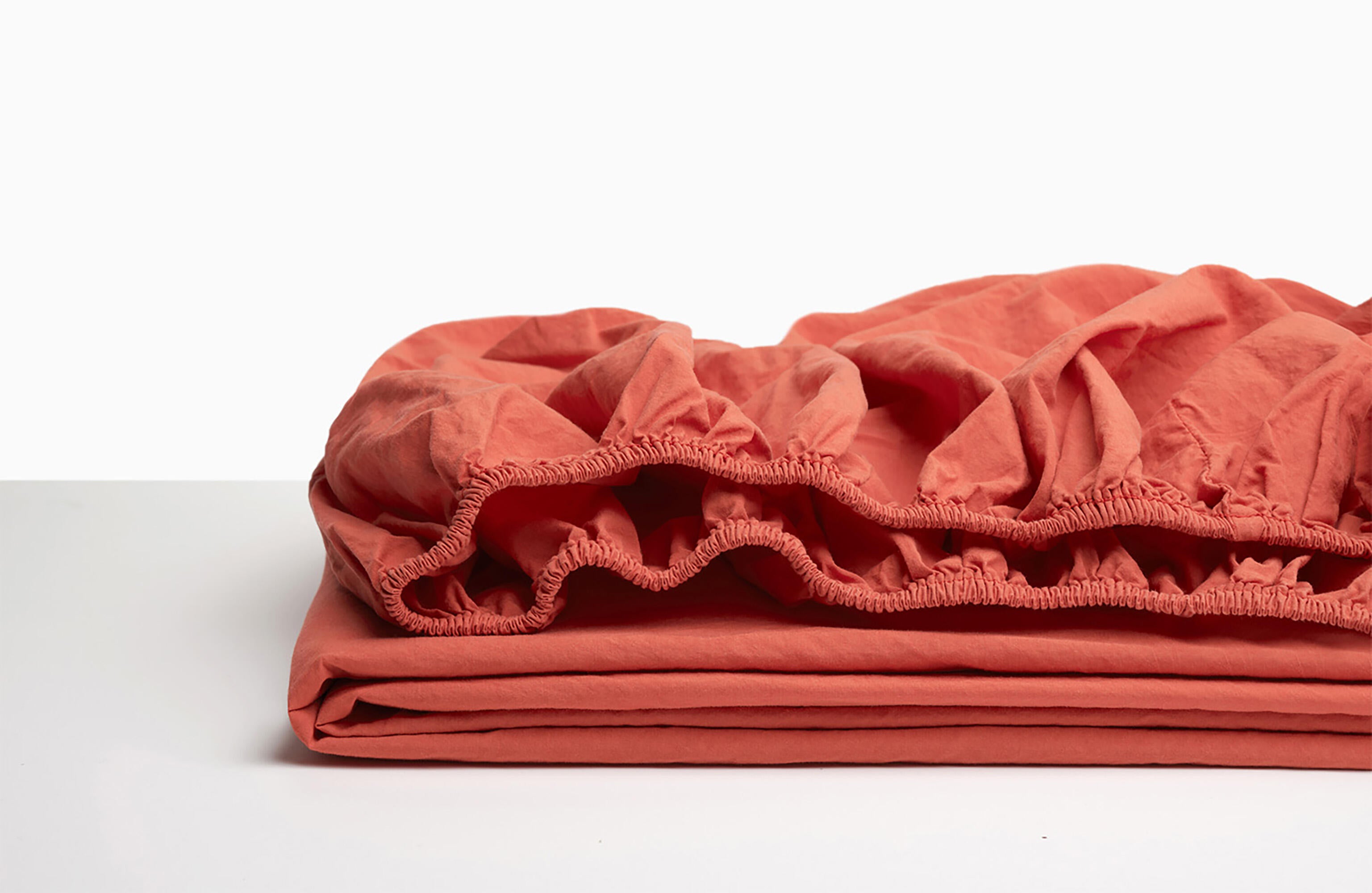 Sábana bajera wash garment percal 200 hilos rojo coral para cama de 200 cm