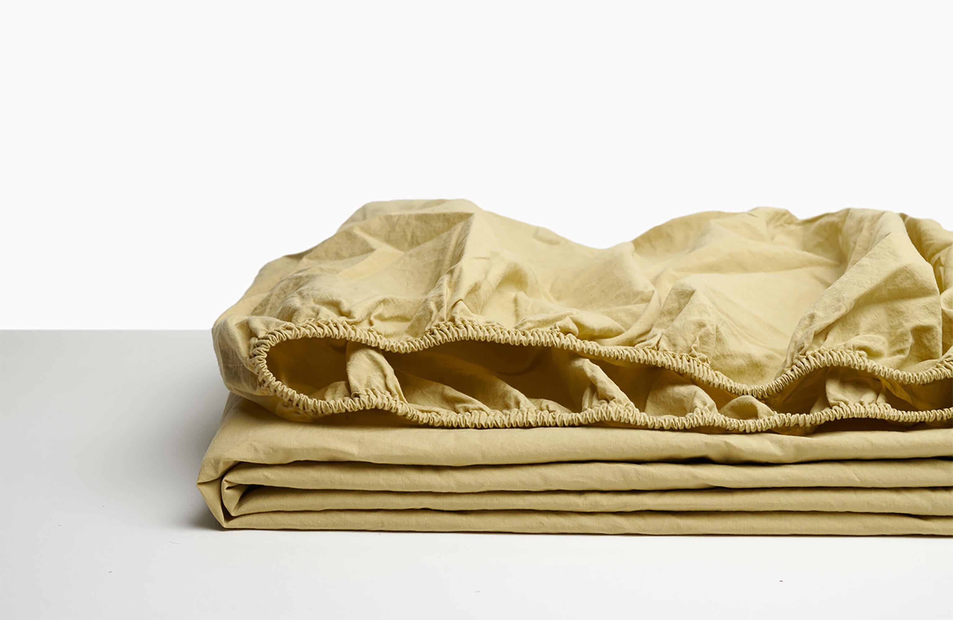 Sábana bajera wash garment percal 200 hilos amarillo para cama de 200 cm