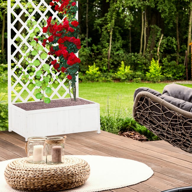 brise-vue terrasse avec bacs à plantes et revêtement de sol en bois
