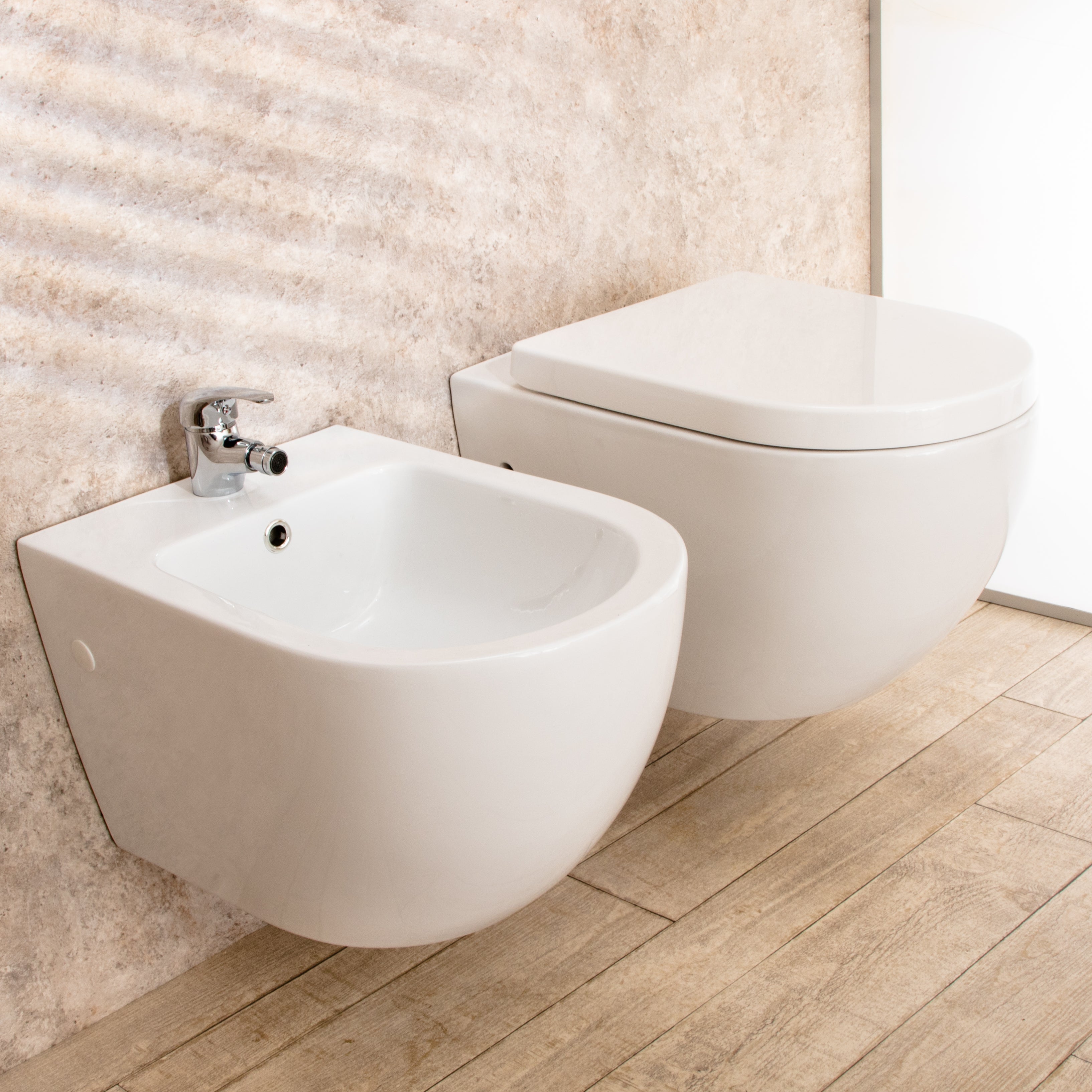 Sanitari Sospesi Vortix in Ceramica Wc senza brida Tavoletta e Bidet