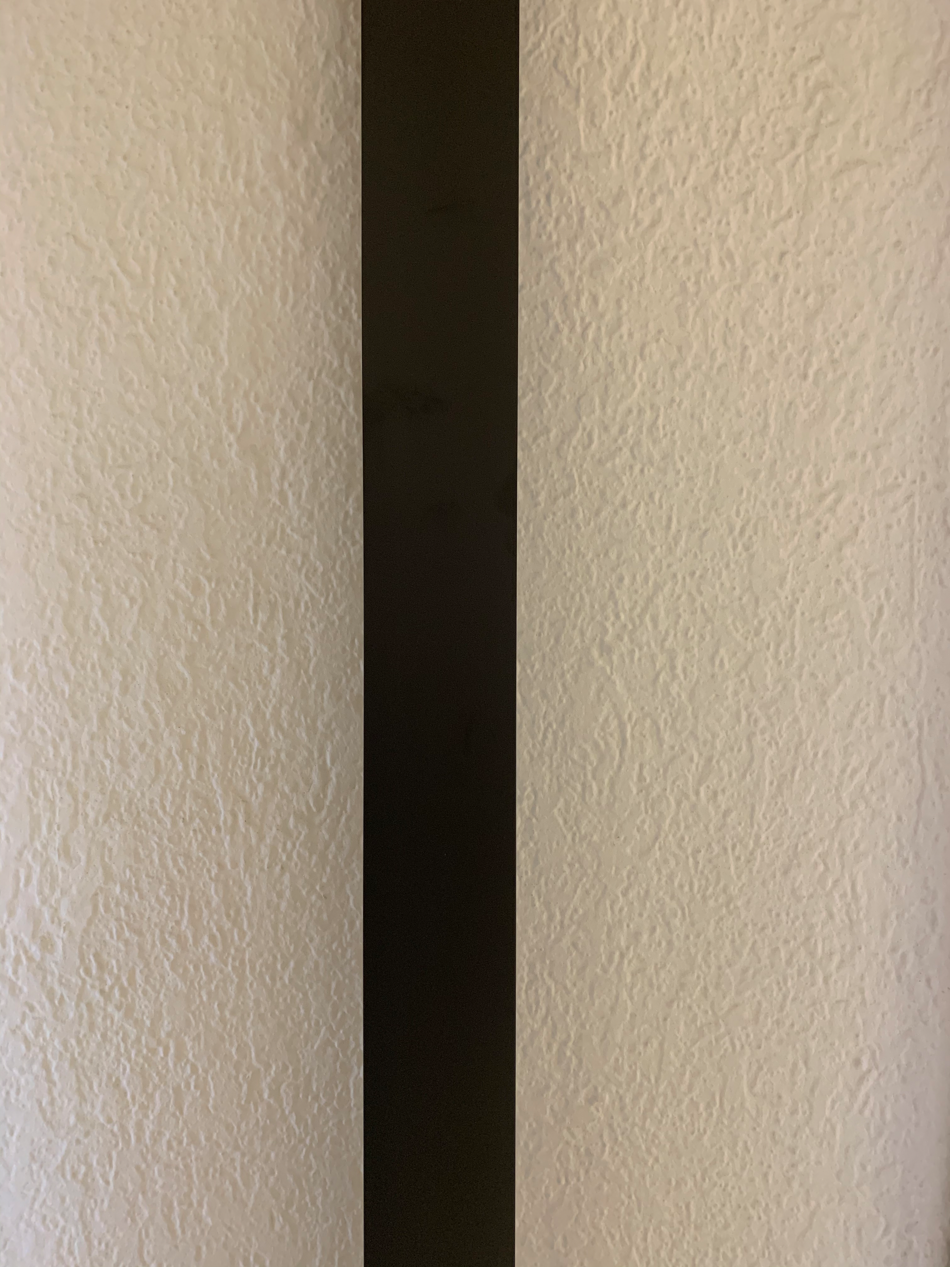 Perfil expansor 2.5 cm para puerta abatible negro cromado mate