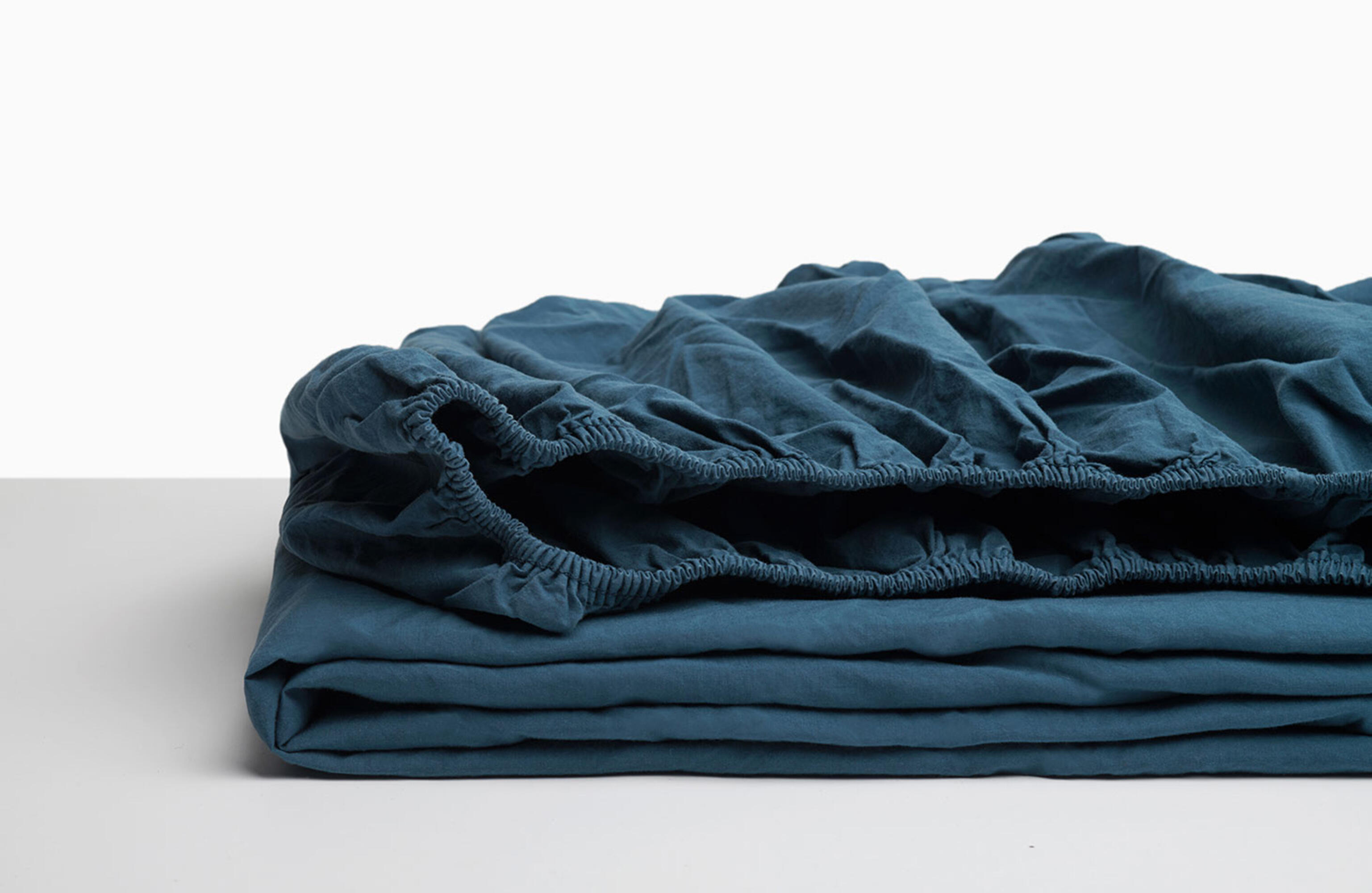 Sábana bajera wash garment percal 200 hilos azul noche para cama de 150 cm