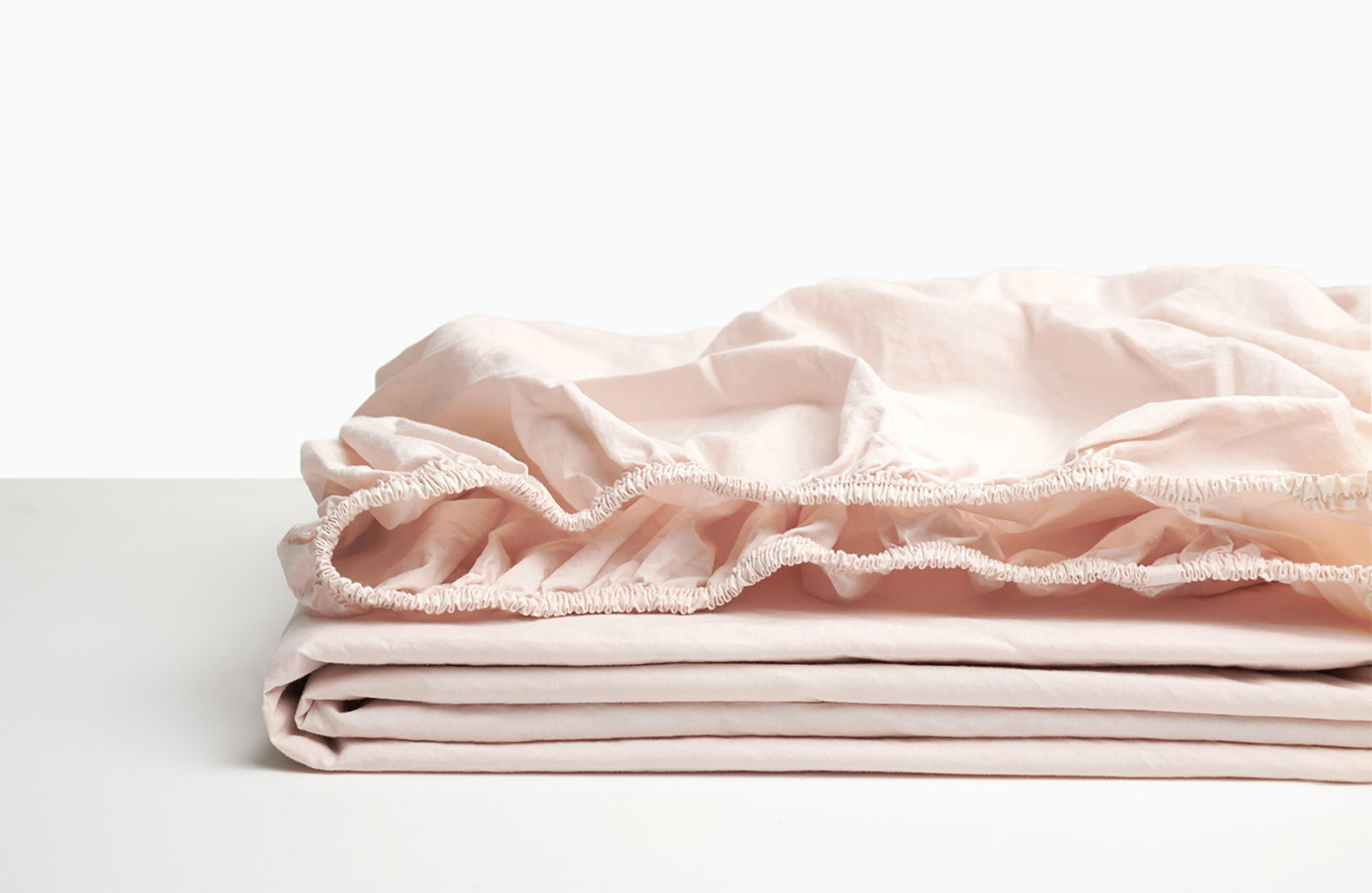 Sábana bajera wash garment percal 200 hilos rosa bebe para cama de 105 cm