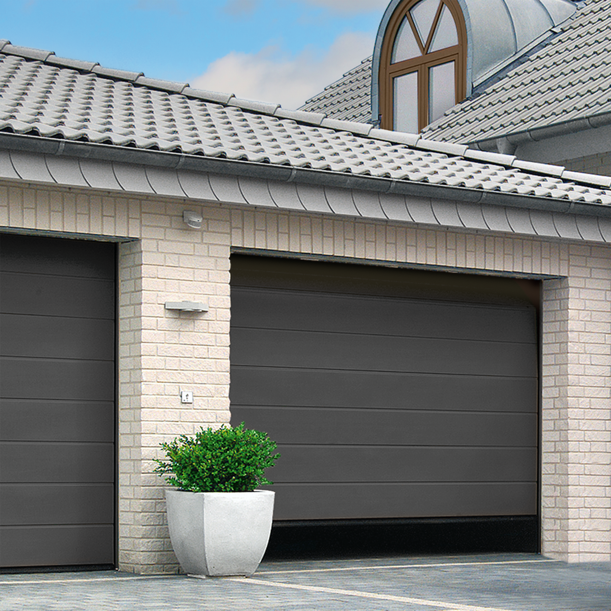 Garaż z bramą segmentową Isomatic.