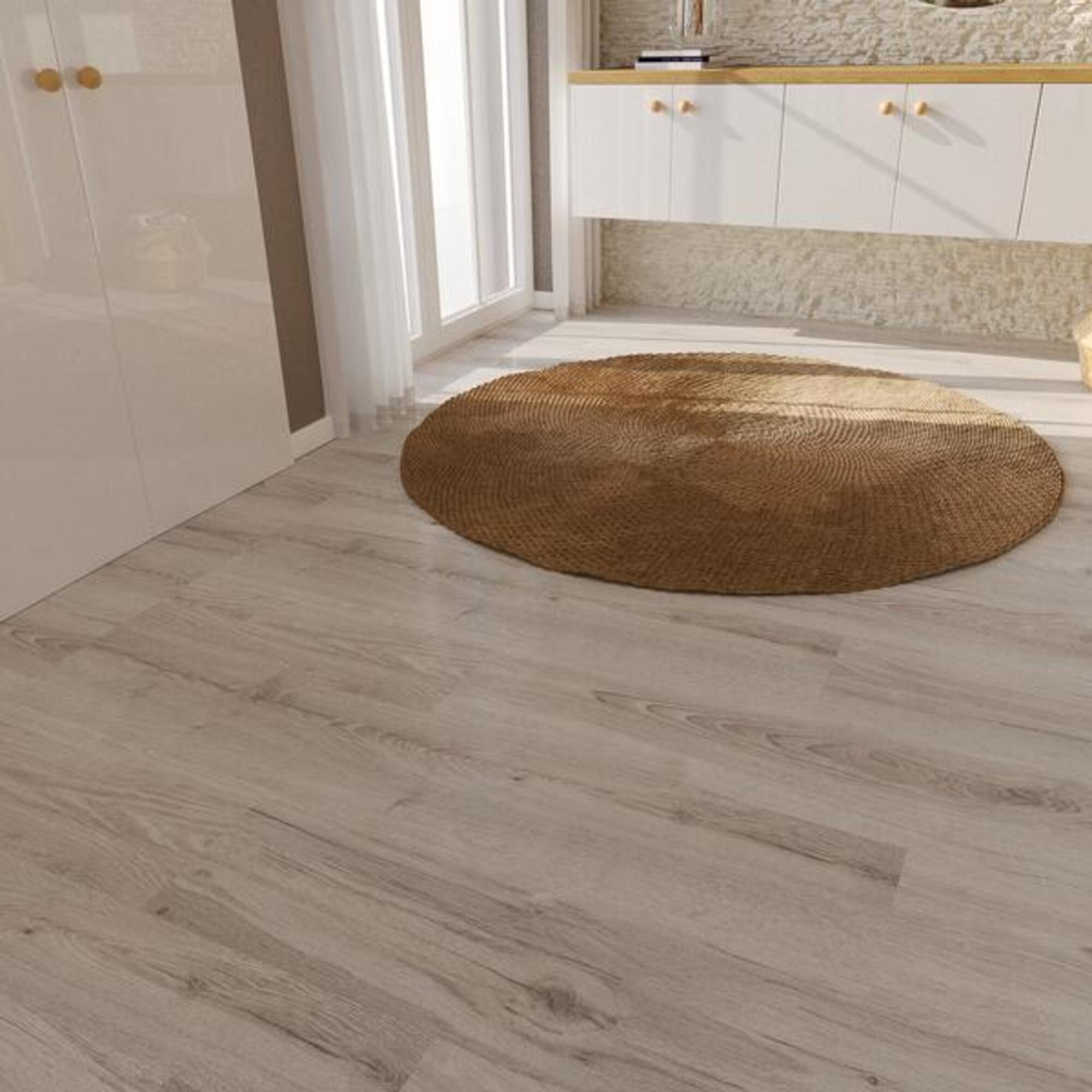 Podłoga z paneli laminowanych Promo Flooring Dąb Jasper z okrągłym dywanem.