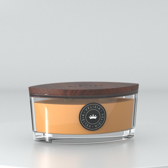 Candela profumata  essenza arancia e spezie H 8.5 cm