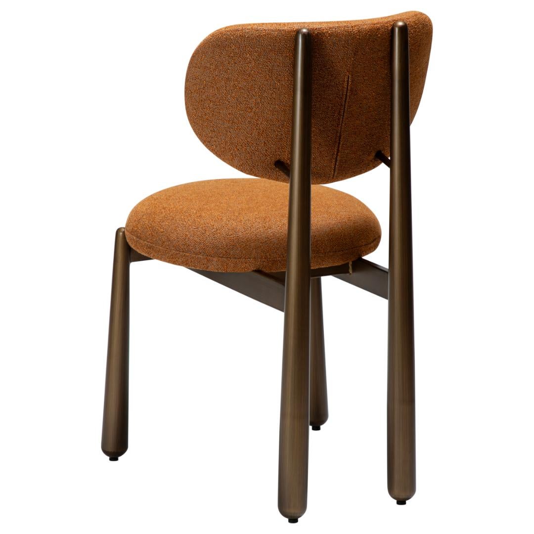 Woke Dan-Form krzesło stołowe bouclé palony pomarańczowy.