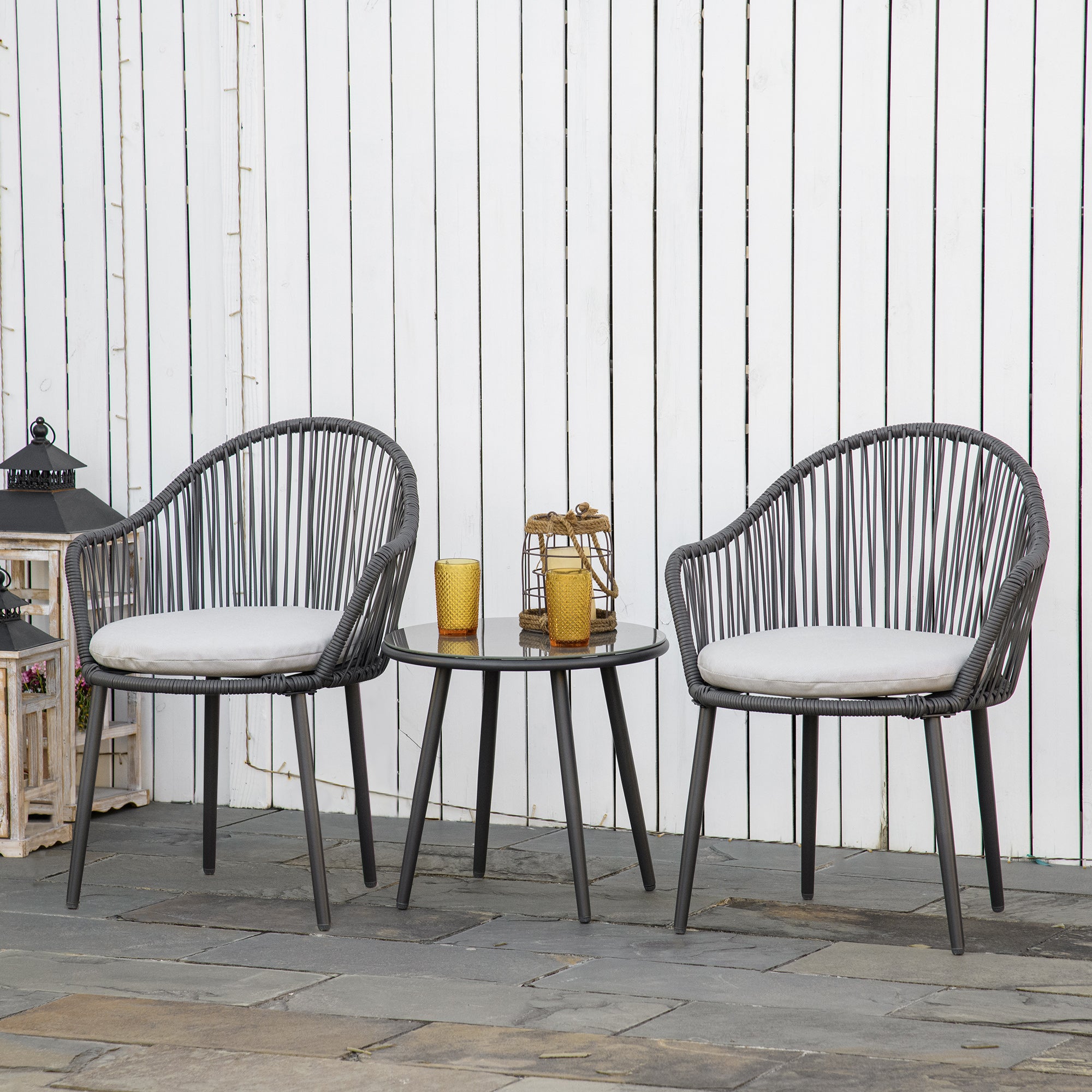 Salotto da giardino in rattan con poltrone con cuscini e