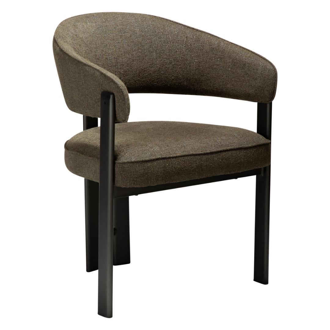 Duct Dan-Form krzesło stołowe z podłokietnikami bouclé ciemnozielony.