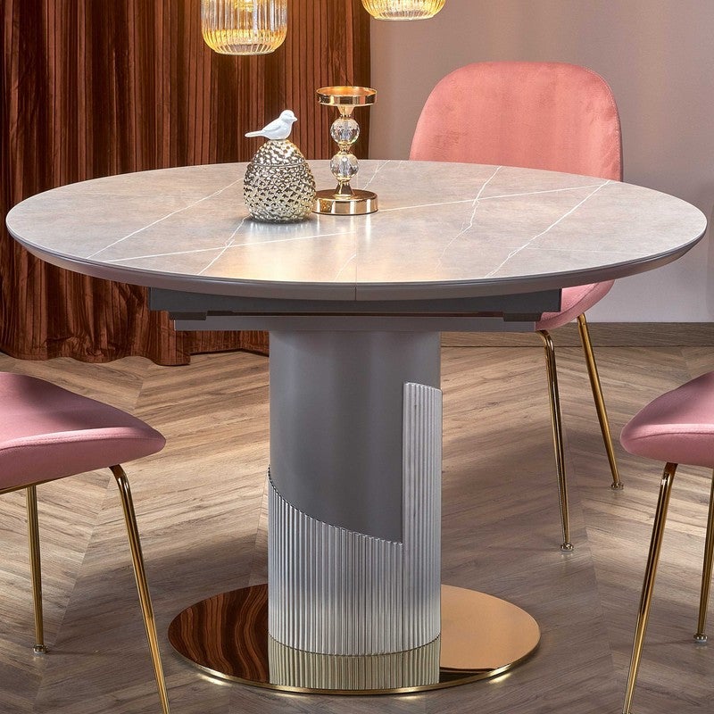 Tavolo rotondo allungabile con piano in simil marmo e gamba