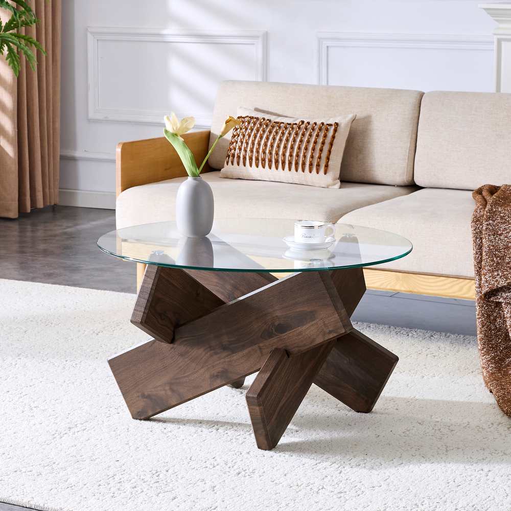 Okrągły stolik kawowy z płyty MDF i szkła, 79 cm, ze skrzyżowanymi nogami z drewna orzechowego i blatem ze szkła hartowanego o grubości 0,8 cm.