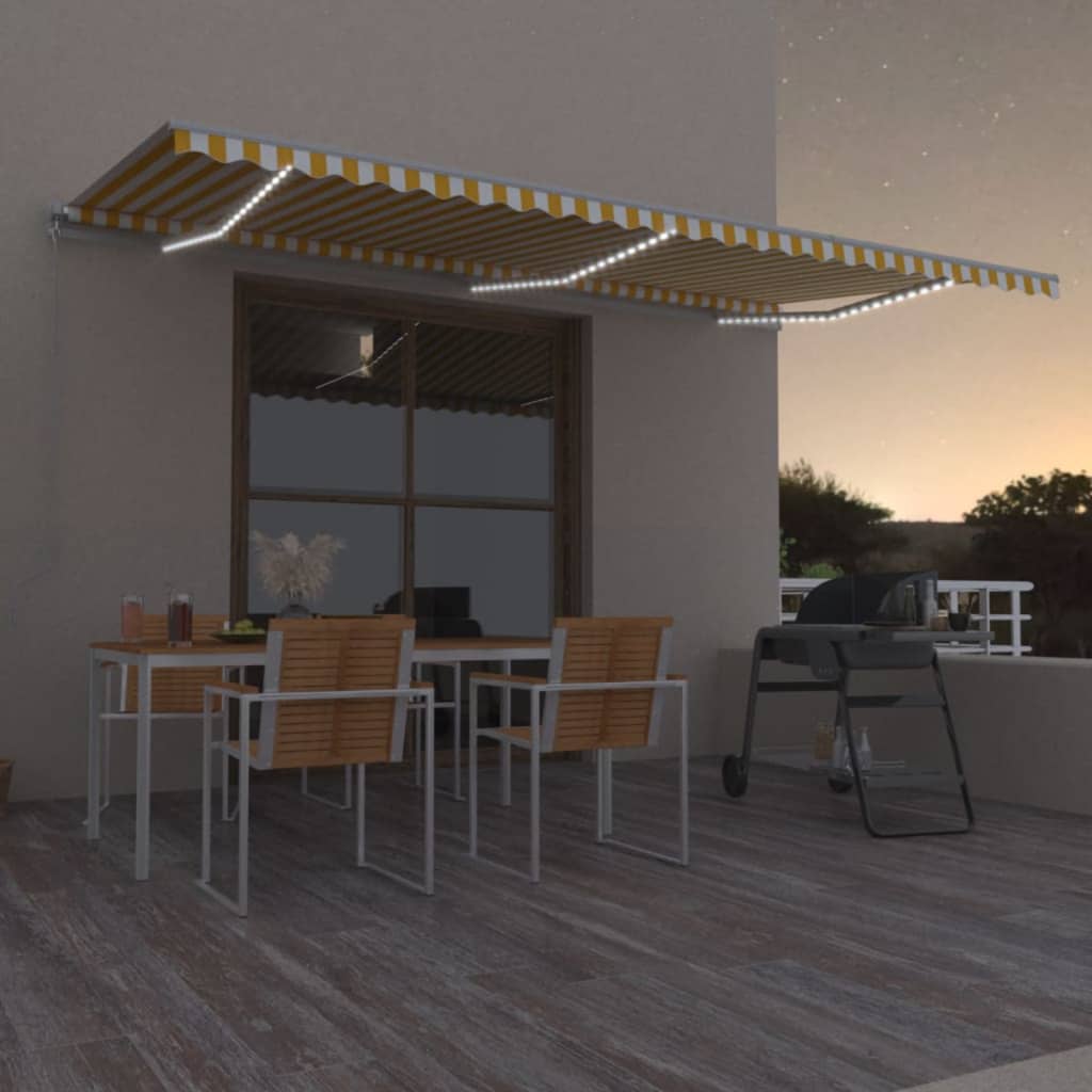 Ręcznie zwijana markiza z LED, 600x350 cm, żółto-biała vidaXL