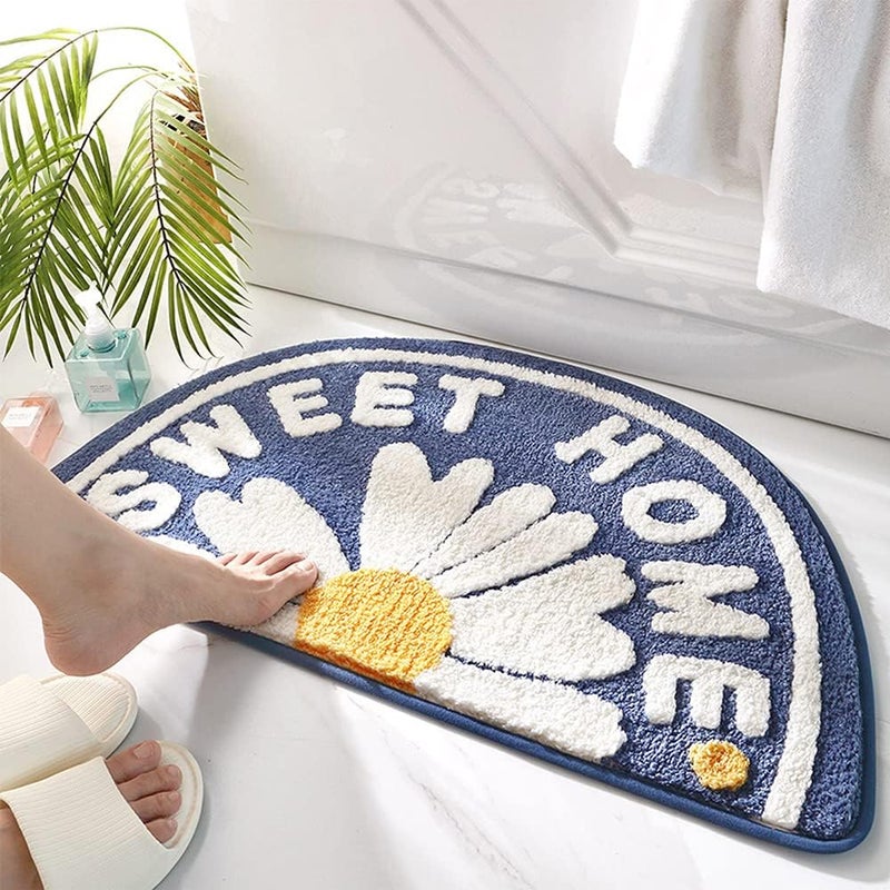 Niebieska antypoślizgowa mata łazienkowa, 75 x 45 cm, zmywalna, z nadrukiem stokrotek.