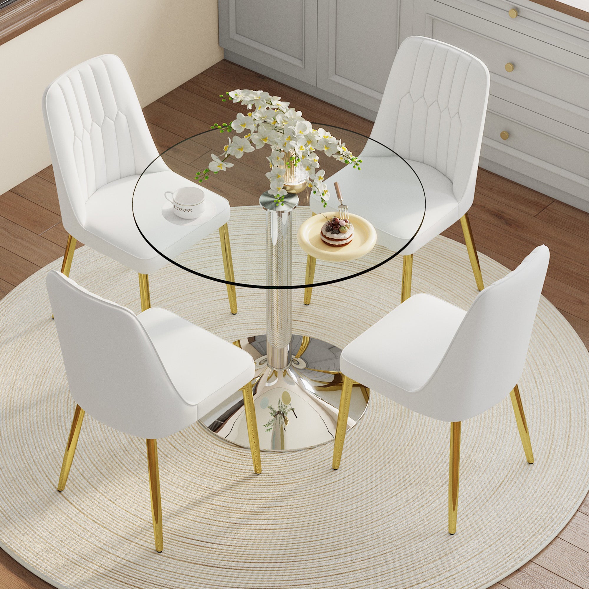 Mesa redonda de 85cm de cristal templado con base de metal plateado + 4 sillas de pu blanco con patas de metal dorado