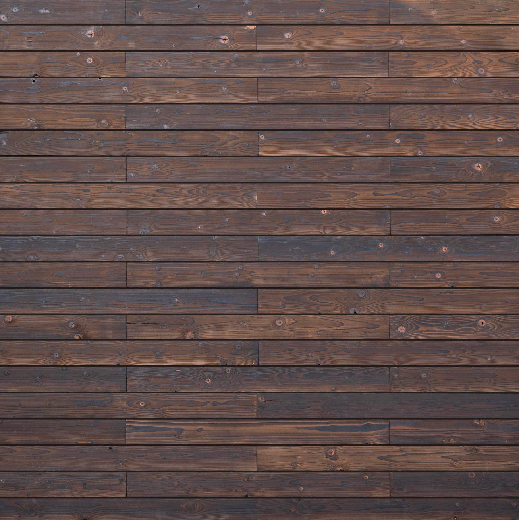 Painel de parede em madeira maciça, acabamento ripado carbonizado - encaixe macho-fêmea - 18x120x1191 mm - Interior/Exterior - 1m²/7 painéis - 2