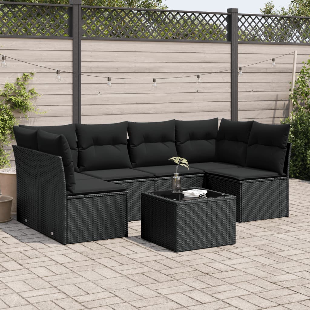 Muebles de jardín de 7 piezas con cojines de resina tejida en negro.