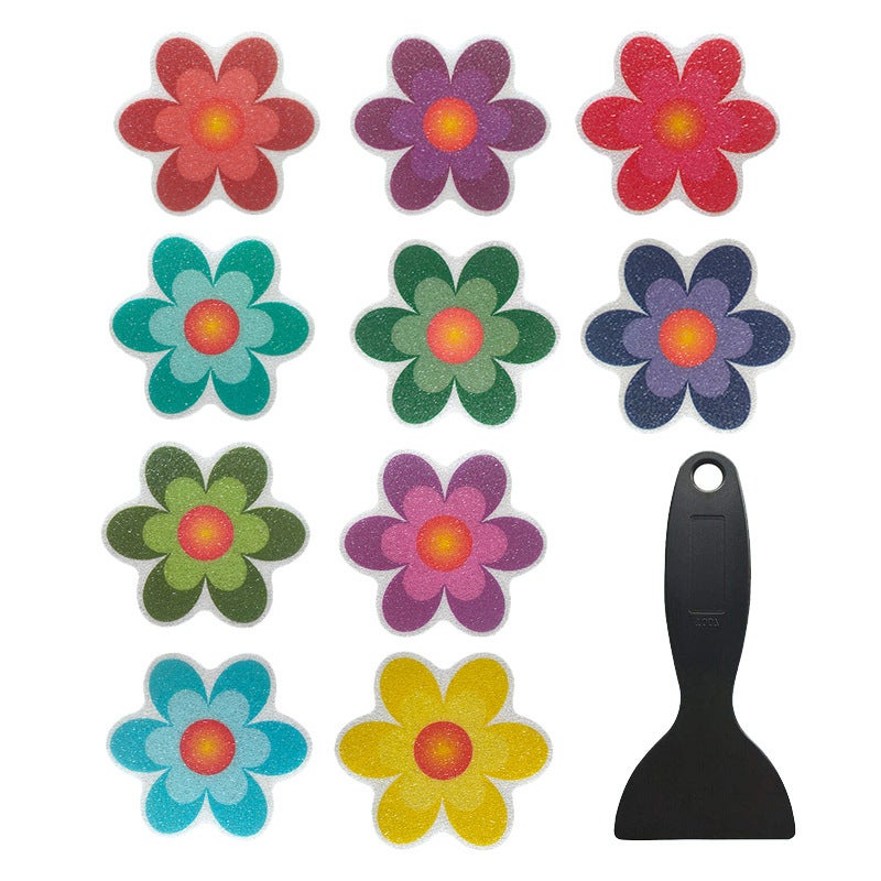 10 wodoodpornych, antypoślizgowych naklejek w kształcie słonecznika oraz skrobak do wanny i łazienki.