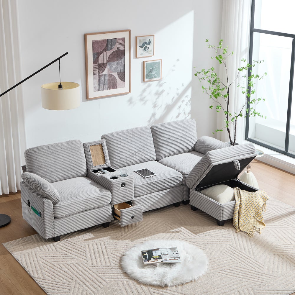 Duża sofa z kordu z pianką zapewniającą wygodę, konsolą centralną, portem USB-C i pufem ze schowkiem, szara