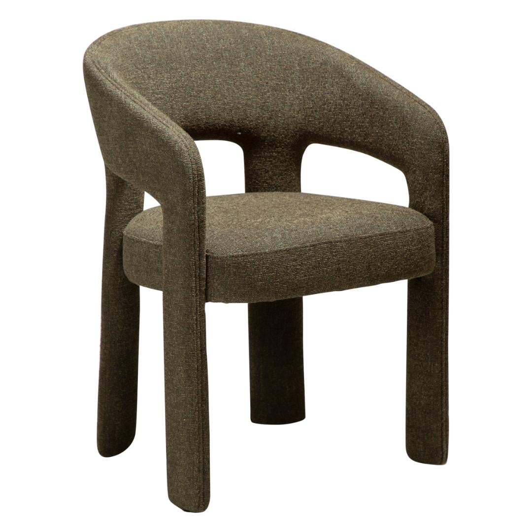 Splendor Dan-Form krzesło stołowe z podłokietnikami bouclé ciemnozielony.