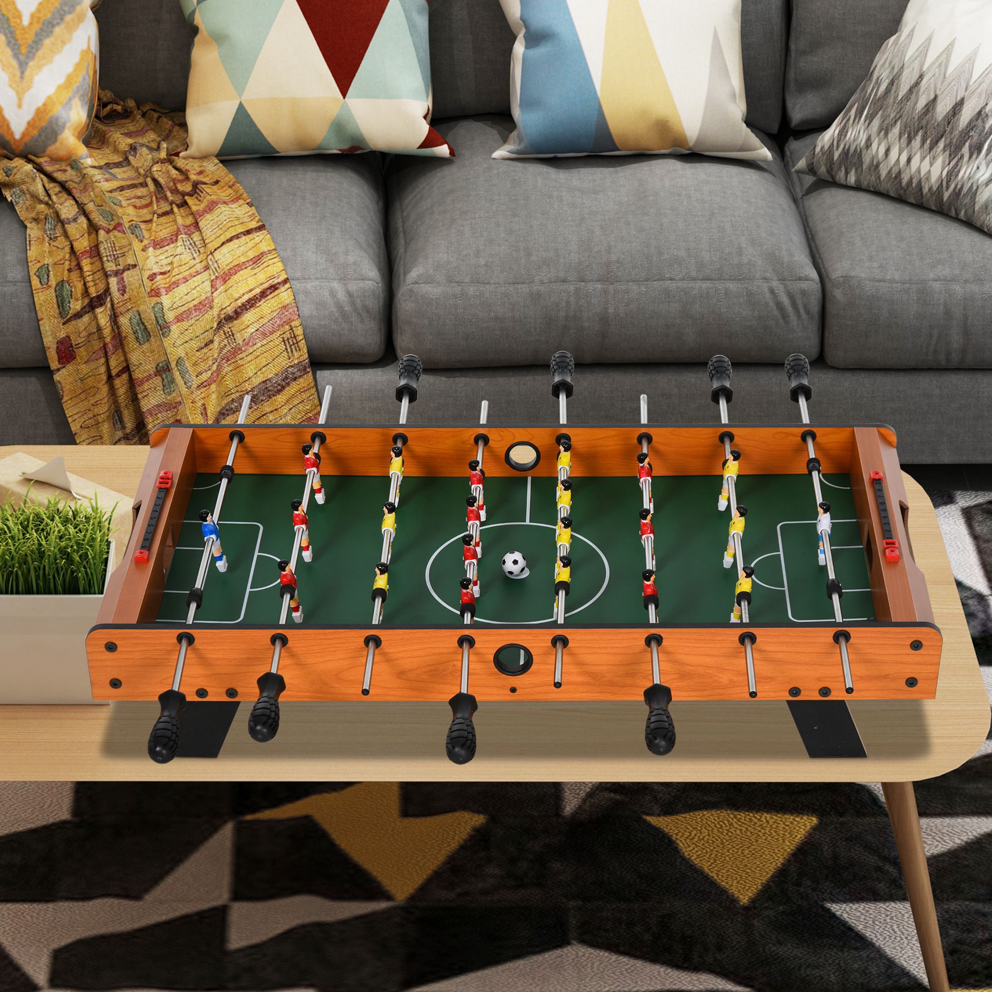 Esta mini mesa de matraquilhos permite até 22 jogadores e inclui 2 bolas e 2 placares. Dimensões: 84,5 cm (C) x 40 cm (L) x 61,2 cm (A). - 4