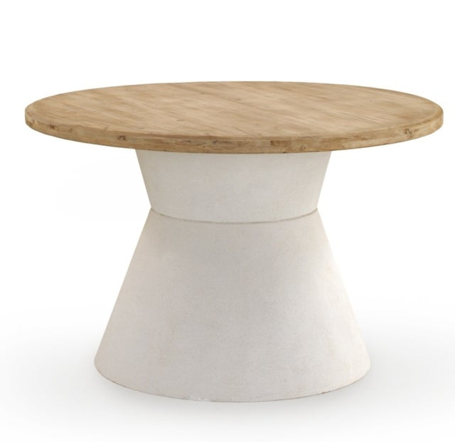 Mesa de comedor redonda en madera de abeto y base de poliresina blanca