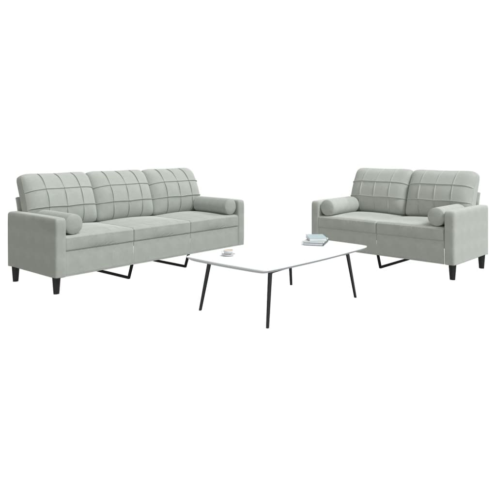 Conjunto de sofás de 2 piezas y cojines y almohadones de terciopelo.