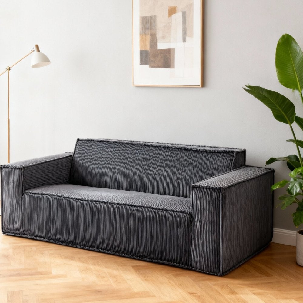 Nowoczesna, dwuosobowa sofa z kordu, głębokie i wygodne siedzisko, gruba poduszka, idealna do salonu lub biura