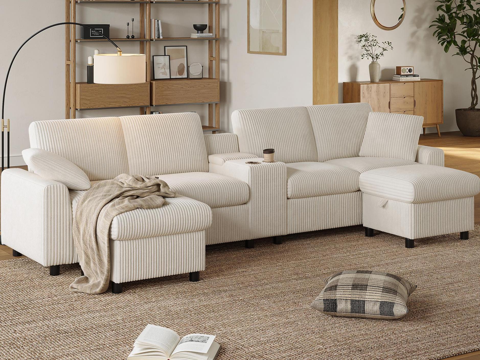 Nowoczesna sofa narożna w kształcie litery U - z portami USB i typu C - z 2 podnóżkami ze schowkiem - z 2 uchwytami na kubki - sztruks - beżowa